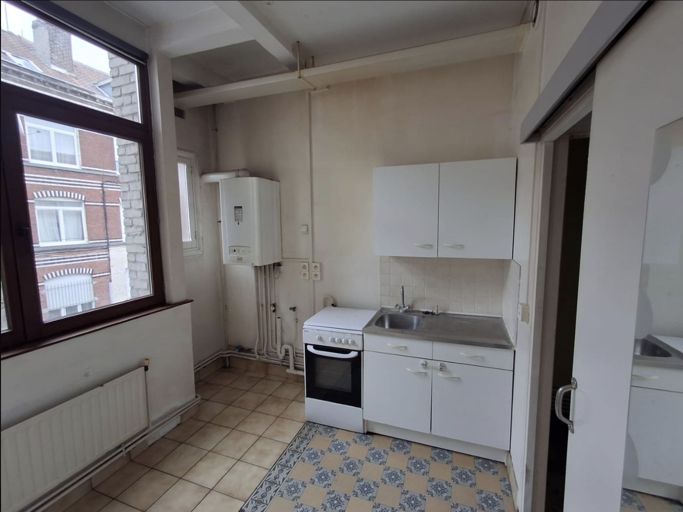 Cuisine d'origine avant travaux, immeuble de Lille